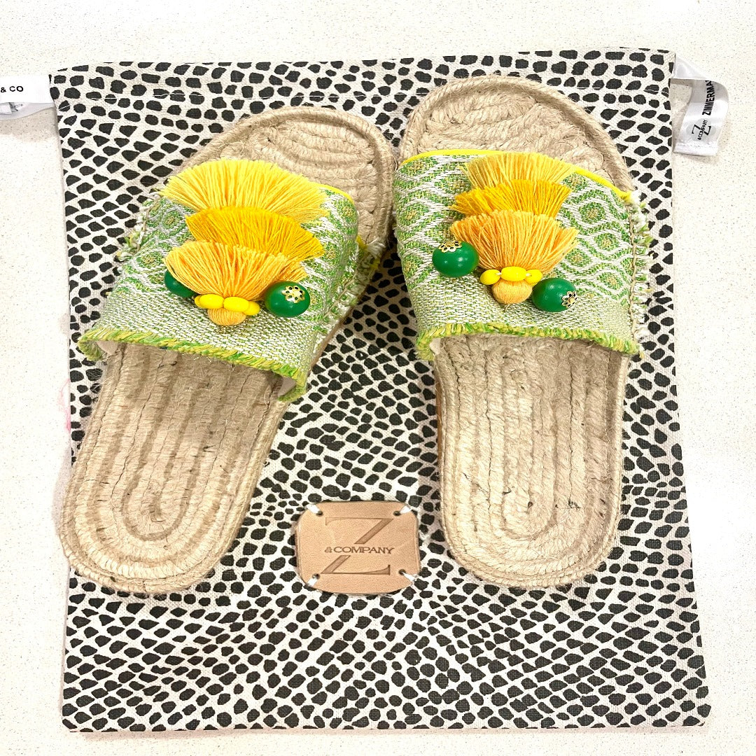 Hand crafted espadrilles - one of a kind. Size 39.  Designed using a beautiful lemon and chartreuse woven fabric with yellow ombre tassel and beads.  Fabric lined upper, rubber non slip sole.