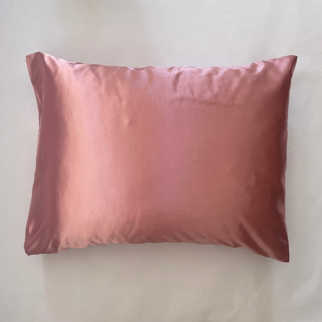 Super silky luxurious satin pillowcase sold individually.   Satin pillowcases help to prevent frizziness on any hair texture.  Sleeping on a smooth surface will help reduce the appearance of sleep lines and the formation of wrinkles on your face and unlike cotton, our satin pillowcase doesn't absorb moisture from your skin helping it to stay hydrated while you sleep for a more youthful complexion.  Available in white, black, navy, rose, ballet slipper pink, chartreuse, gold, silver, Barbie pink and teal.